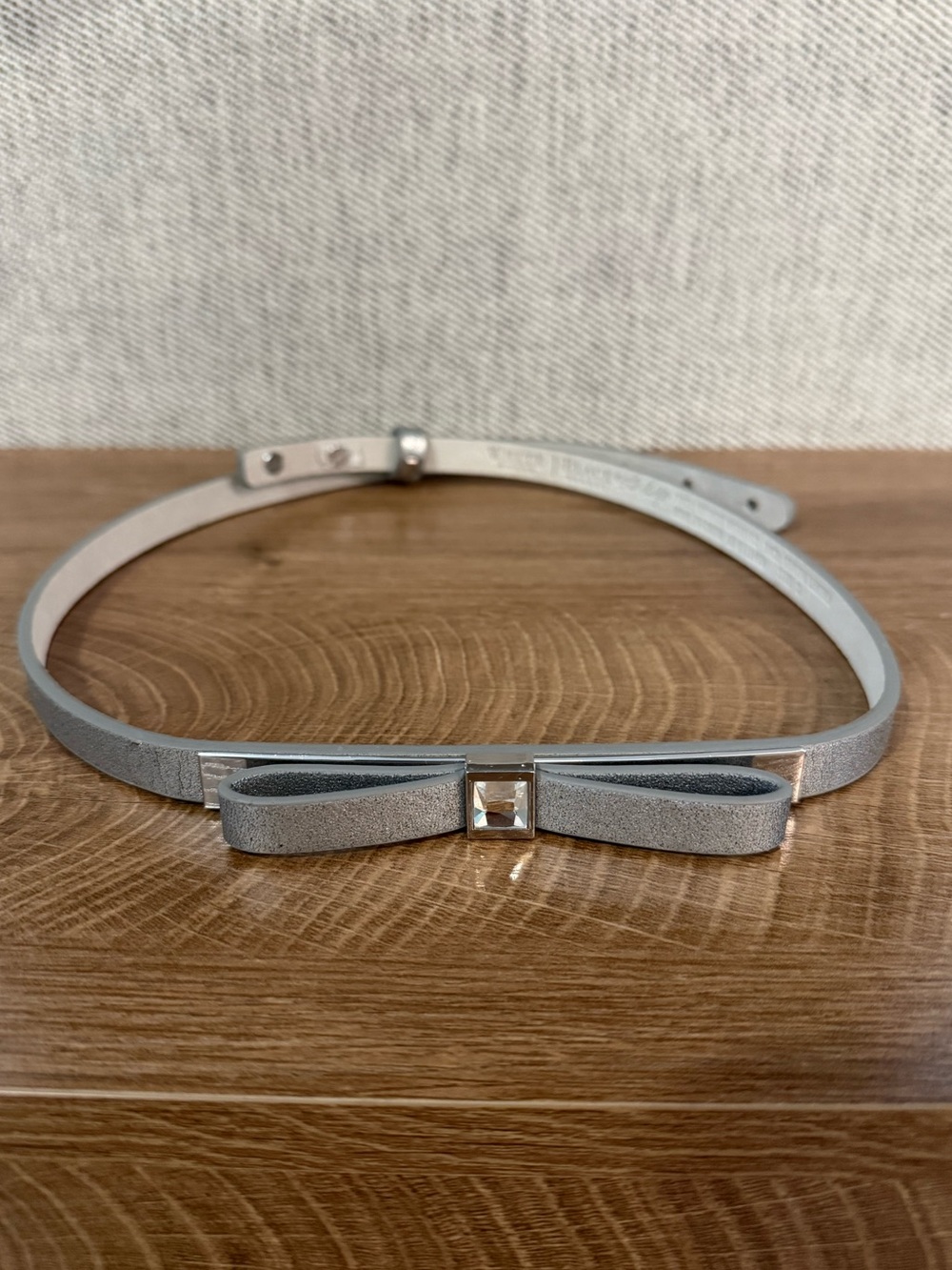 White House | Black Market Women’s Slim Silver Bow Accent Leather Belt